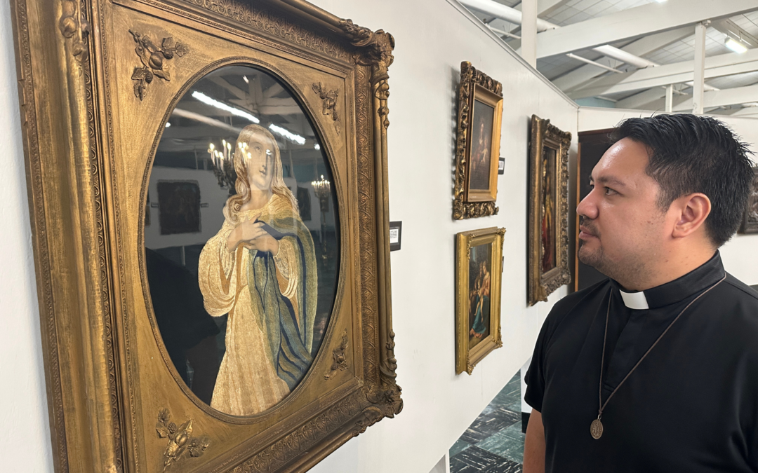 Fr. Rolando Limjoco admires a portrait of Mother Mary at the Central Association for the Miraculous Medal
