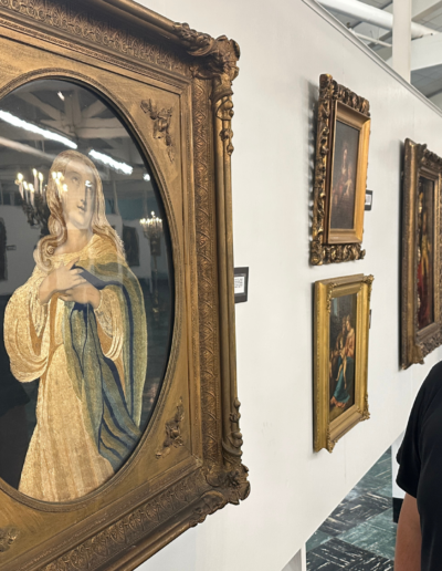 Fr. Rolando Limjoco admires a portrait of Mother Mary at the Central Association for the Miraculous Medal